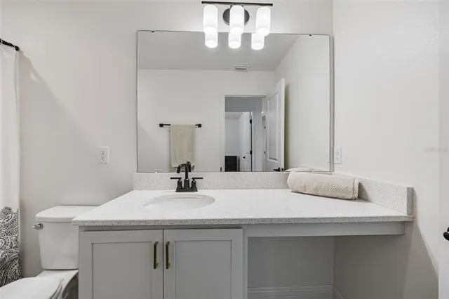 an aerial view of a house with a lake view