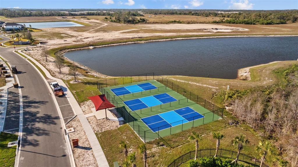 11430 Gallatin Trail Parrish, FL 34219 - Photo 79 of 79 a view of a bedroom with a bed and wooden floor
