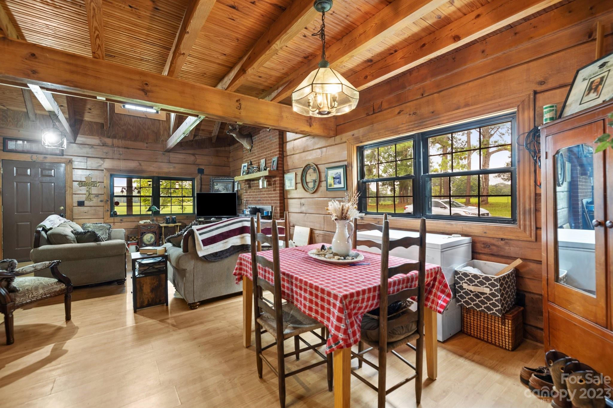 2320 Russell Pope Road Wingate, NC 28174 - Photo 14 of 41 a view of a dining room with furniture window and outside view