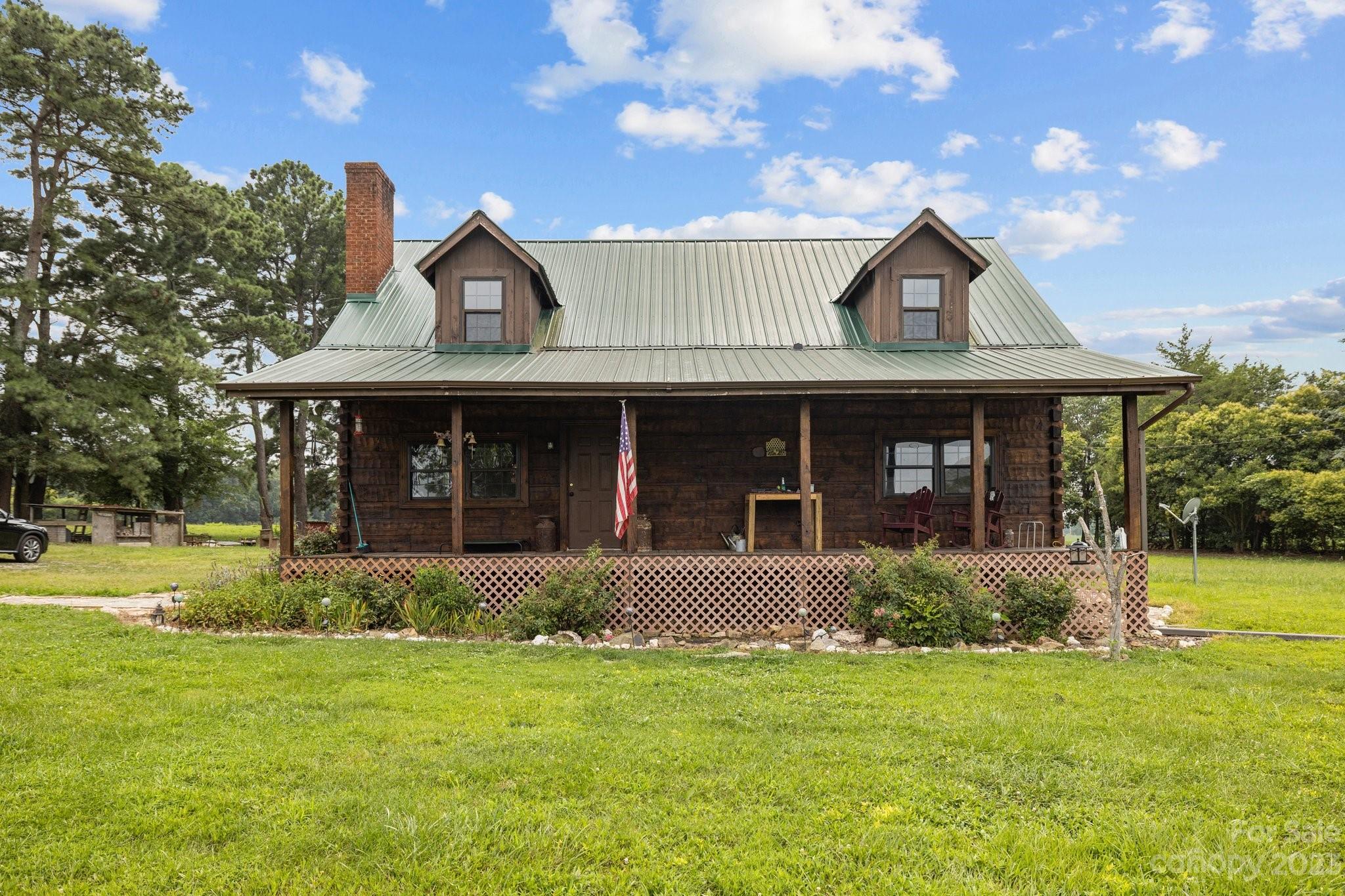 2320 Russell Pope Road Wingate, NC 28174 - Photo 2 of 41 a view of a house with a yard and plants