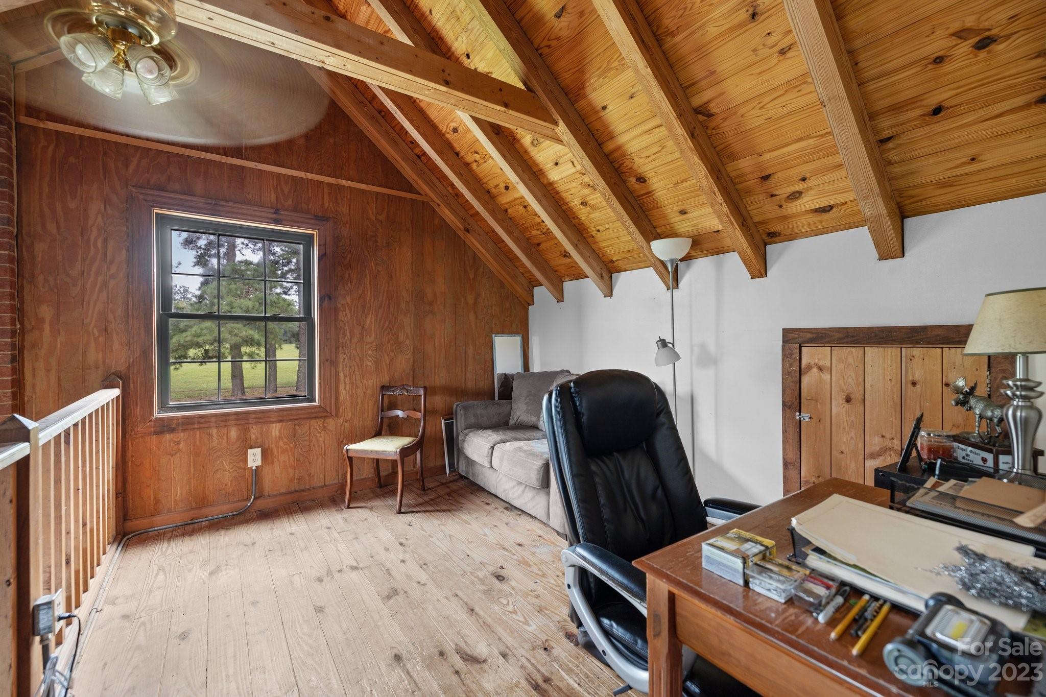 2320 Russell Pope Road Wingate, NC 28174 - Photo 23 of 41 a living room with furniture a window and wooden floor
