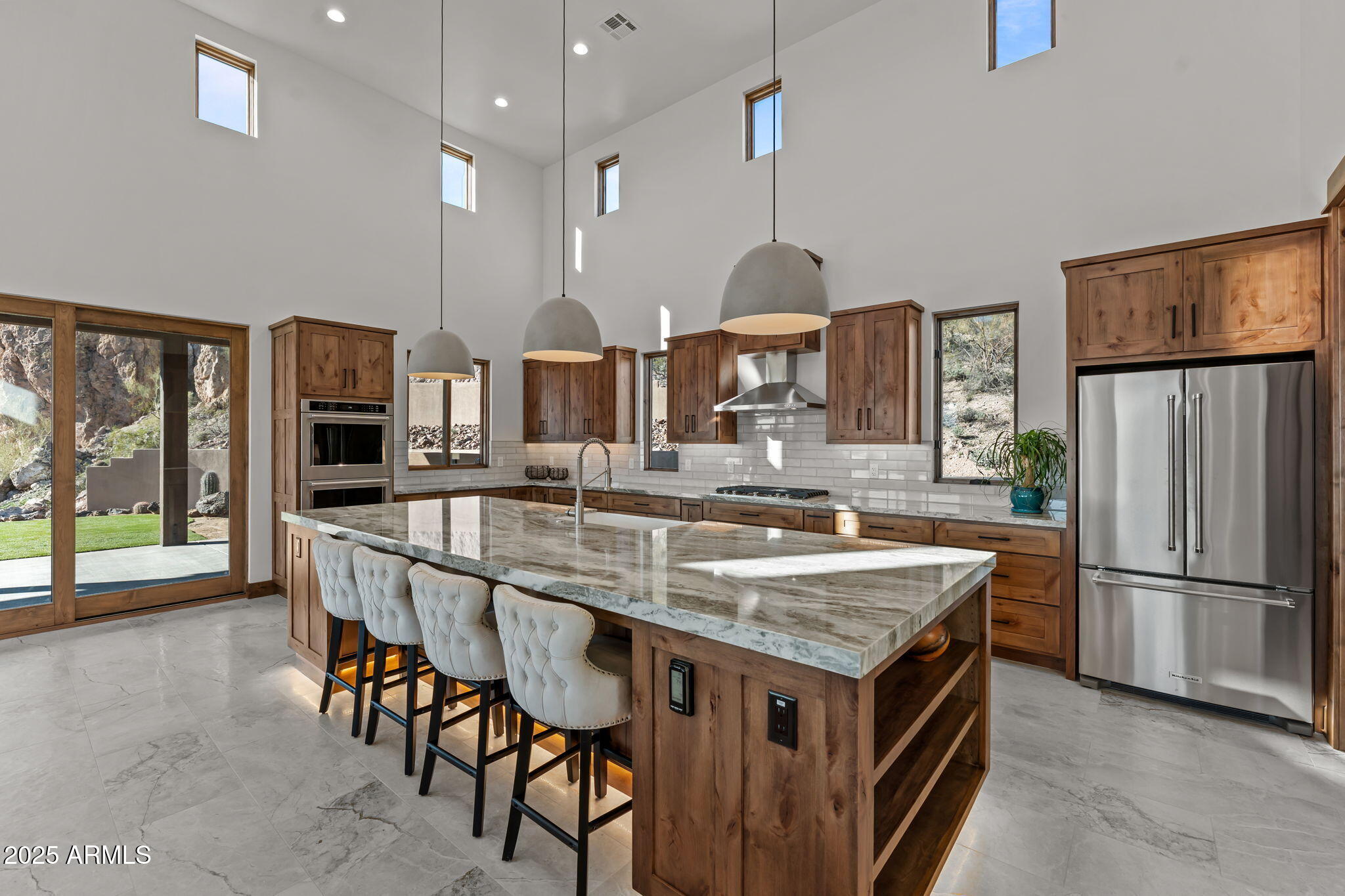 30100 Walter Road Wickenburg, AZ 85390 - Photo 12 of 66 a kitchen with stainless steel appliances granite countertop a stove and refrigerator