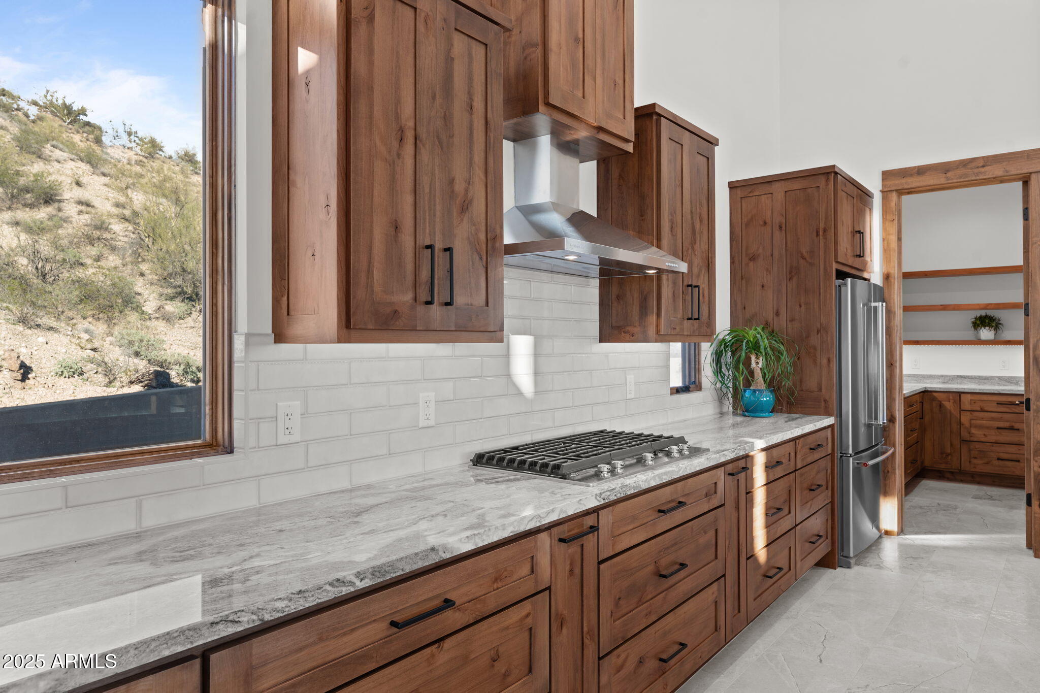 30100 Walter Road Wickenburg, AZ 85390 - Photo 15 of 66 a kitchen with granite countertop a sink stove and cabinets