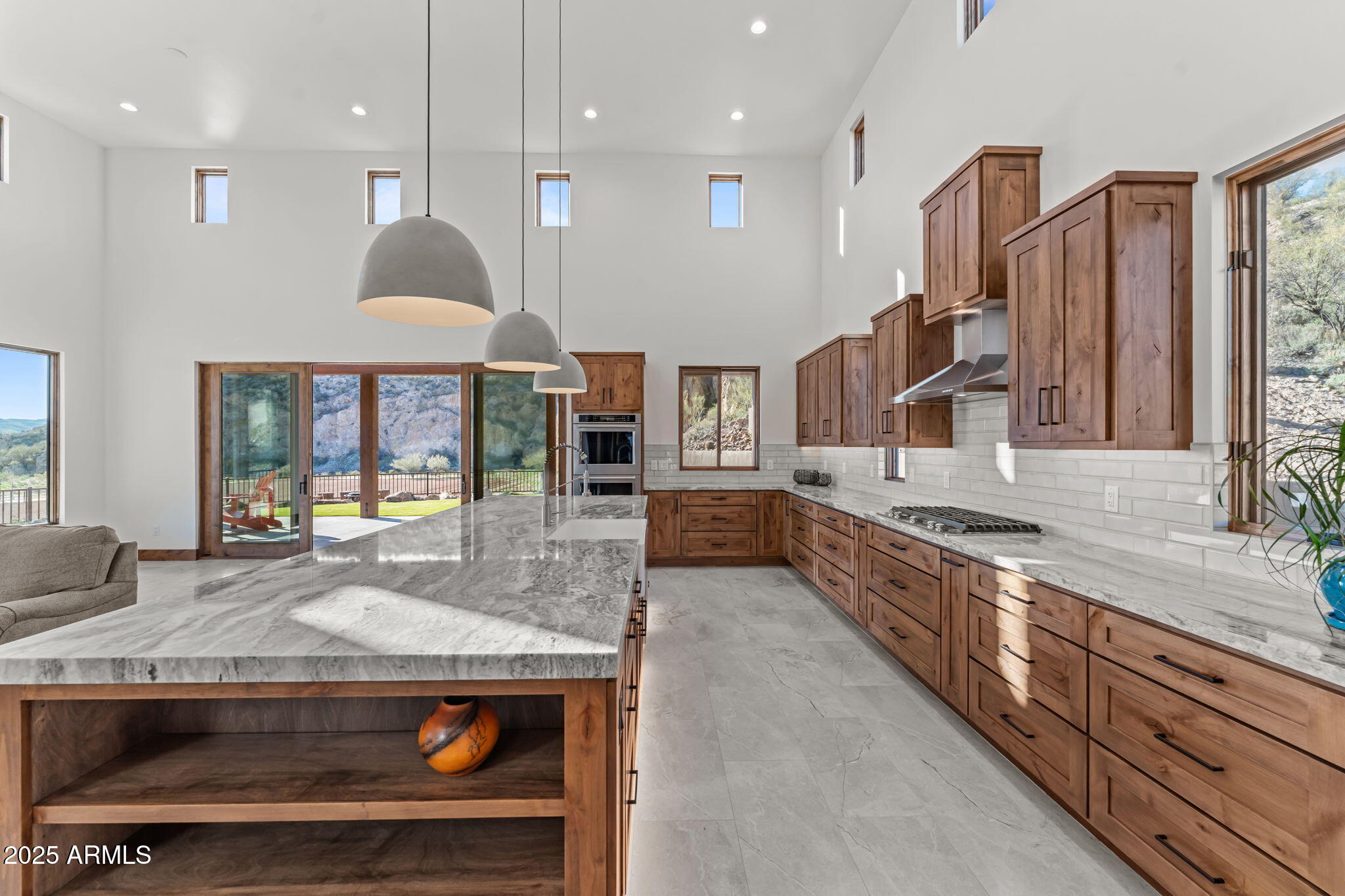 30100 Walter Road Wickenburg, AZ 85390 - Photo 18 of 66 a large kitchen with stainless steel appliances granite countertop a stove and a sink