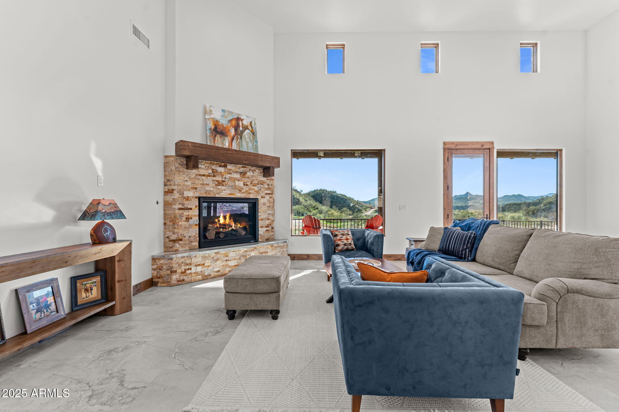 30100 Walter Road Wickenburg, AZ 85390 - Photo 21 of 66 a living room with furniture and a fireplace