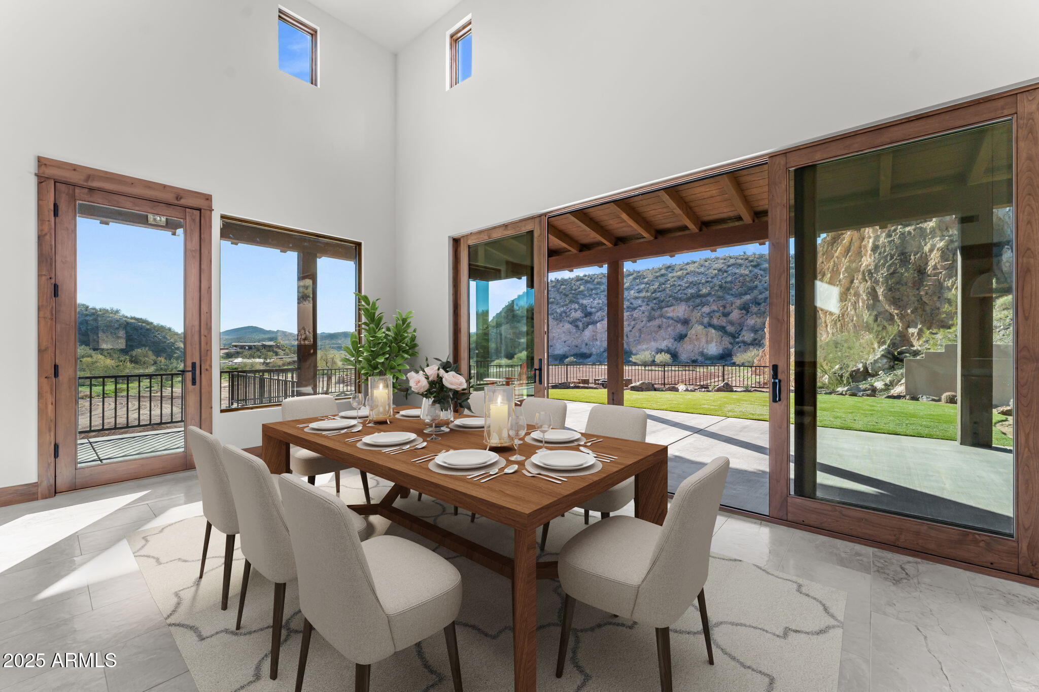 30100 Walter Road Wickenburg, AZ 85390 - Photo 25 of 66 a view of a dining room with furniture large windows and wooden floor