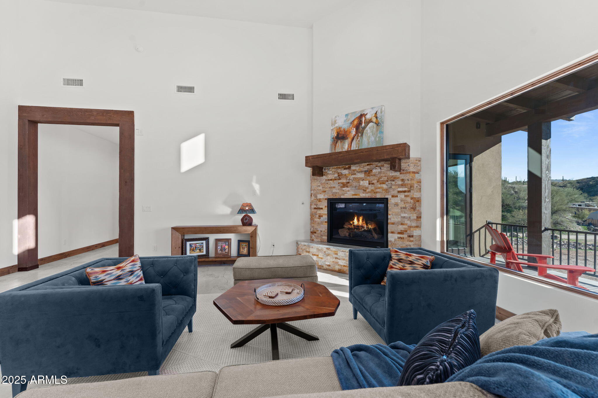 30100 Walter Road Wickenburg, AZ 85390 - Photo 28 of 66 a living room with furniture and a fireplace