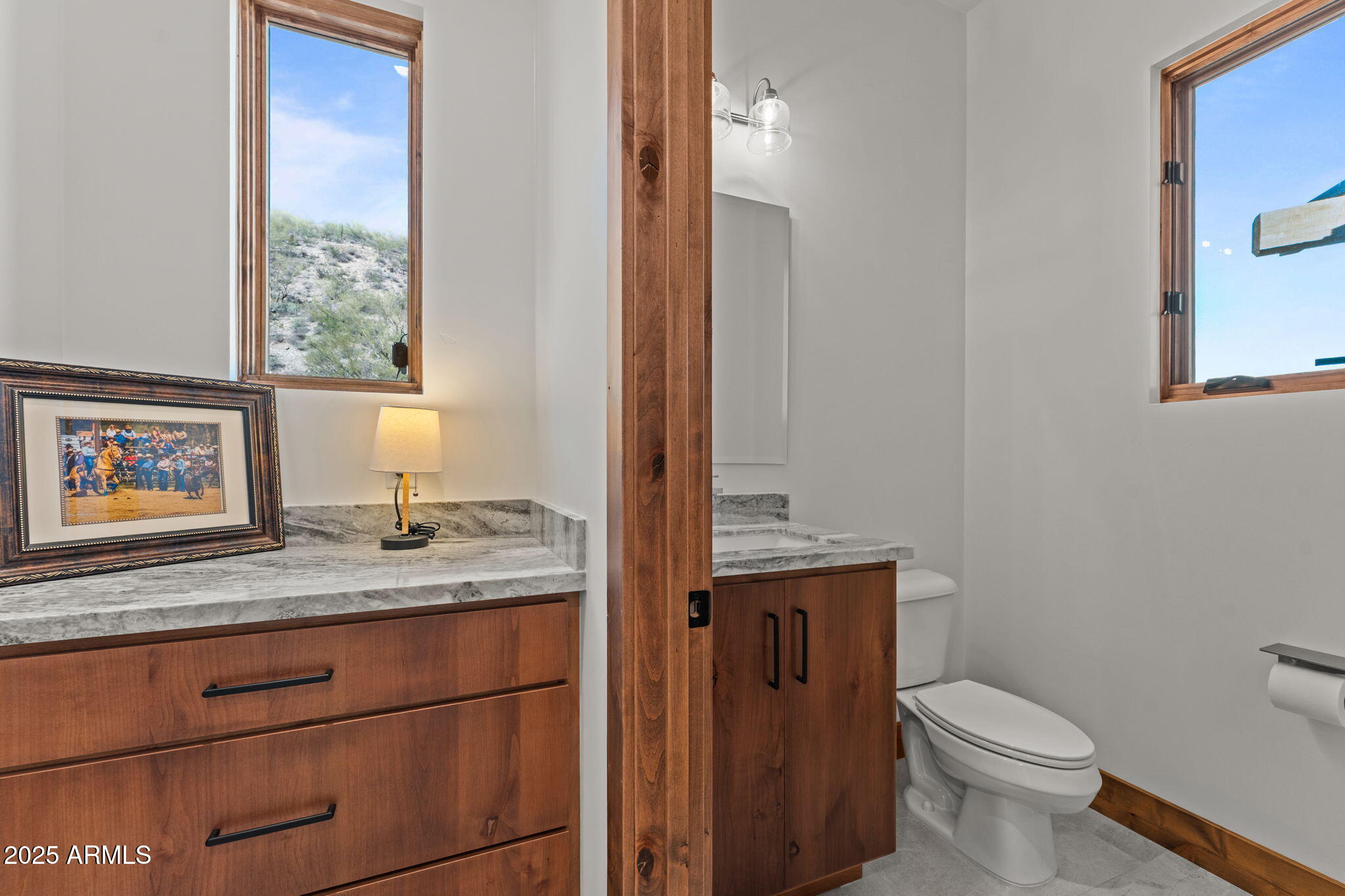 30100 Walter Road Wickenburg, AZ 85390 - Photo 55 of 66 a bathroom with a granite countertop toilet sink and mirror