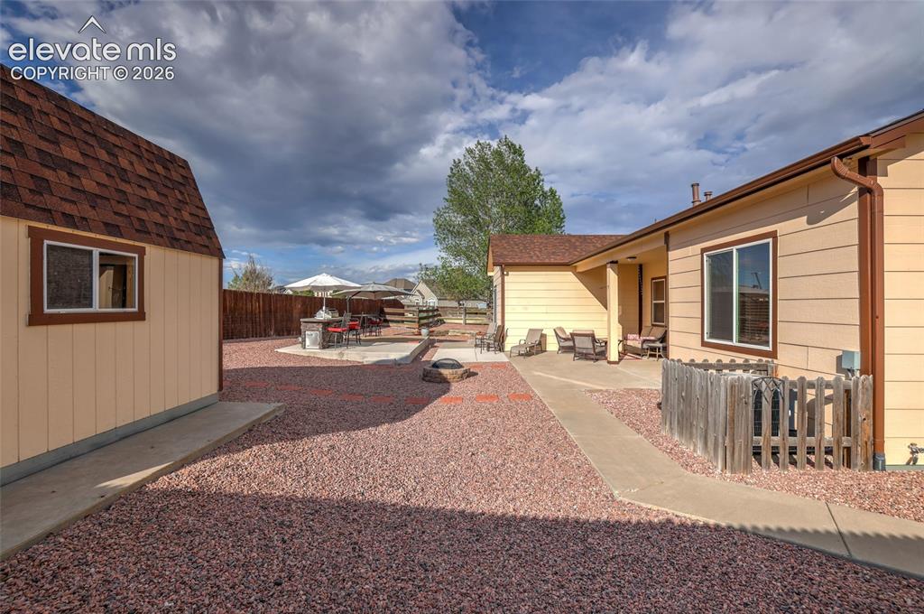 12266 Crystal Downs Road Peyton, CO 80831 - Photo 38 of 50 Shed w loft storage and sidewalk around side of home