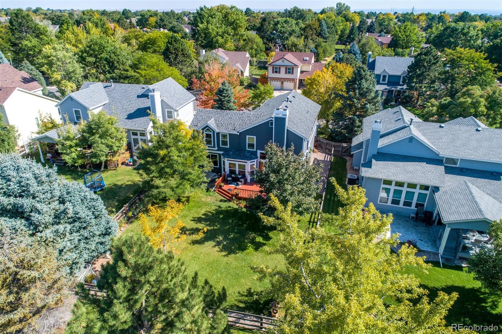 10037 Hooker Street Westminster, CO 80031 - Photo 1 of 40 an aerial view of a house with a yard and lake view