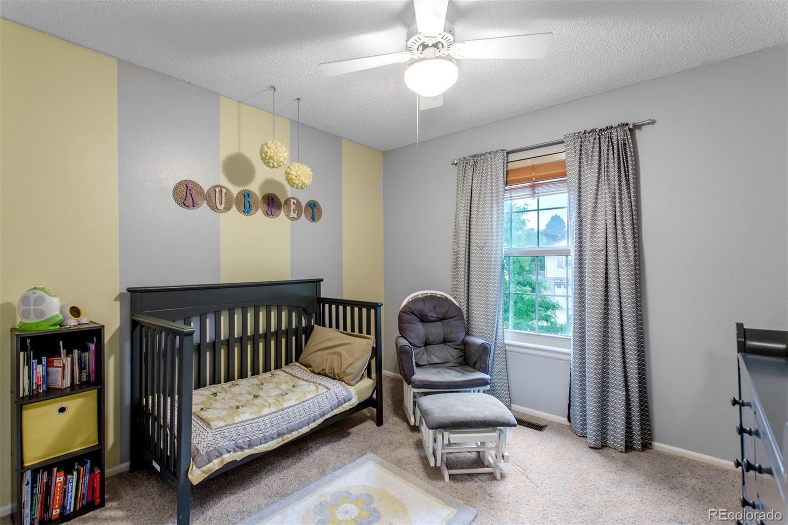 10037 Hooker Street Westminster, CO 80031 - Photo 23 of 40 a bedroom with furniture and a window