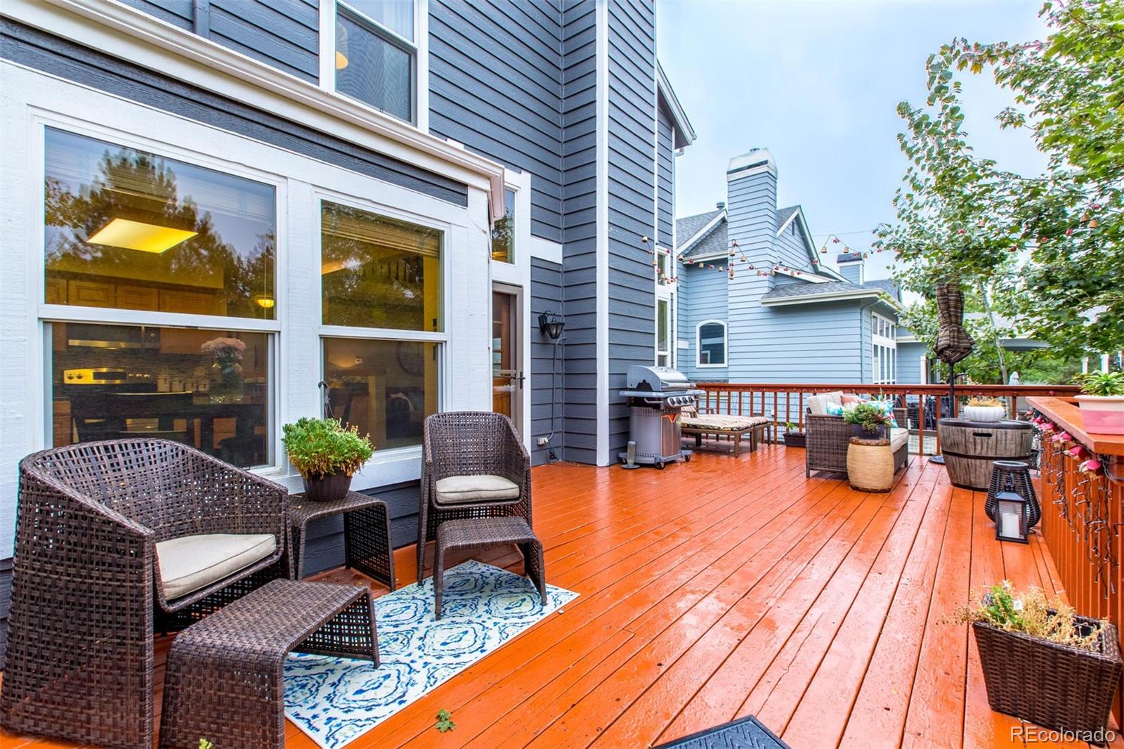 10037 Hooker Street Westminster, CO 80031 - Photo 28 of 40 a view of a patio with couches chairs and a potted plant
