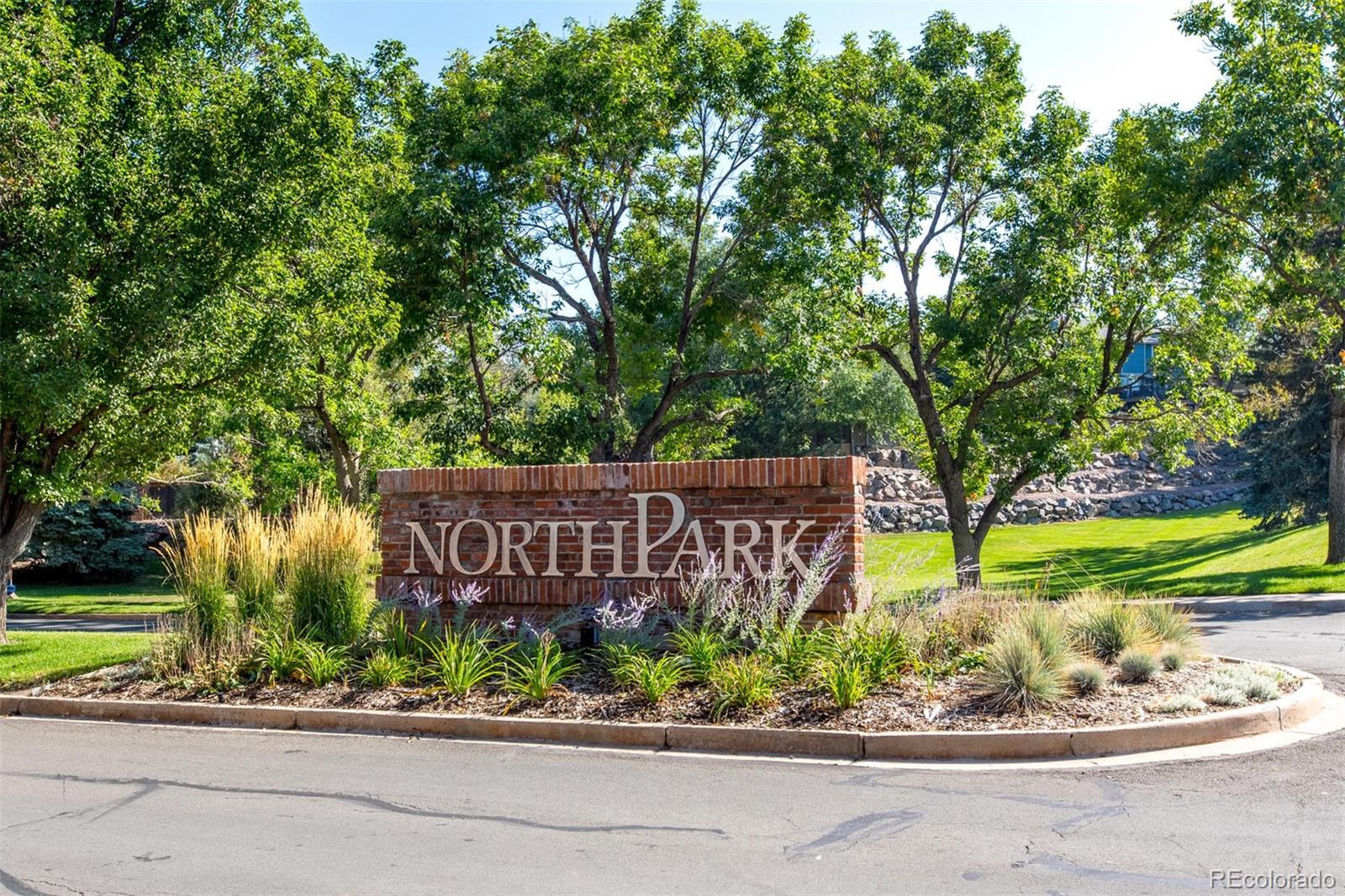 10037 Hooker Street Westminster, CO 80031 - Photo 37 of 40 a sign that is on the side of a road