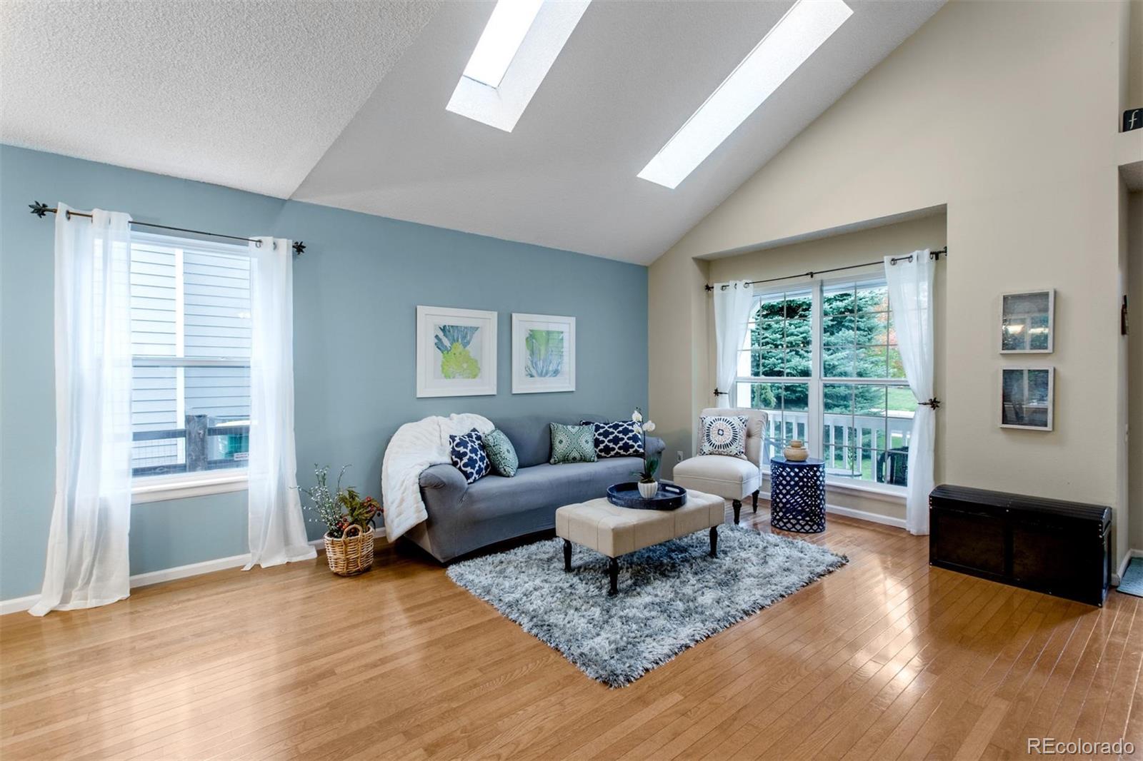 10037 Hooker Street Westminster, CO 80031 - Photo 5 of 40 a living room with furniture and windows