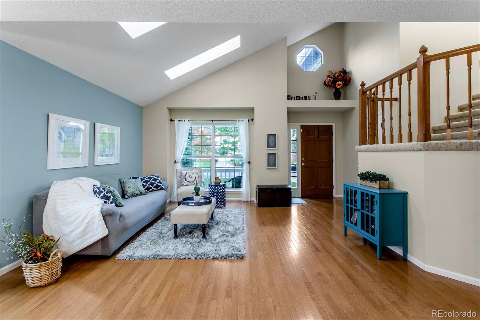 10037 Hooker Street Westminster, CO 80031 - Photo 6 of 40 a living room with furniture and a fireplace