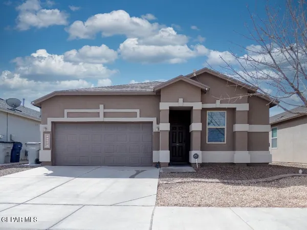 a front view of a house with a garage