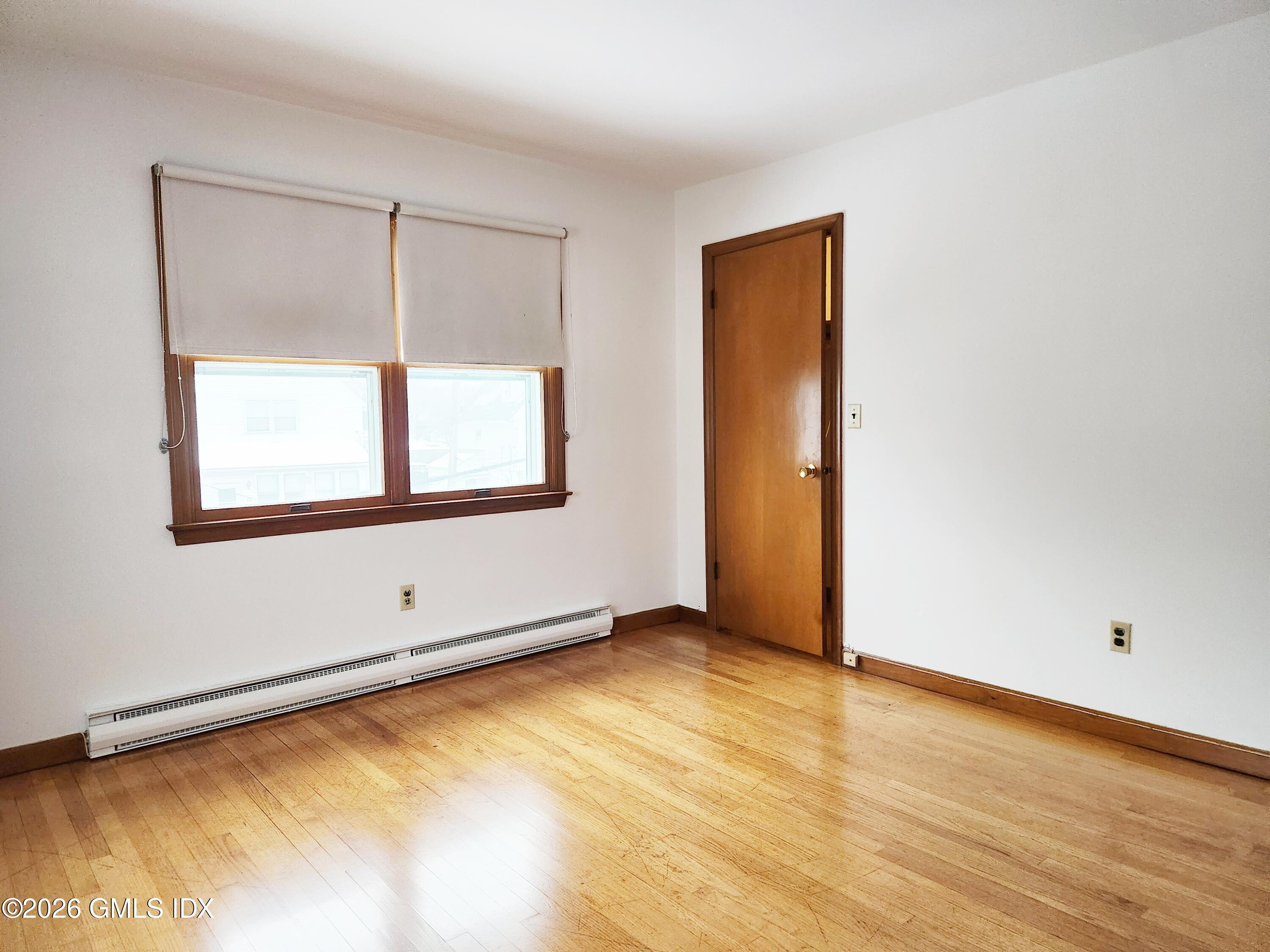 16 Harold Avenue, Unit B Greenwich, CT 06830 - Photo 8 of 17 an empty room with window
