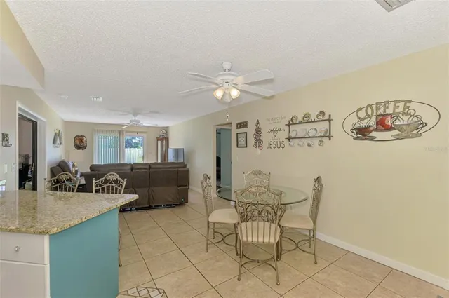 a living room with a couch and a chandelier