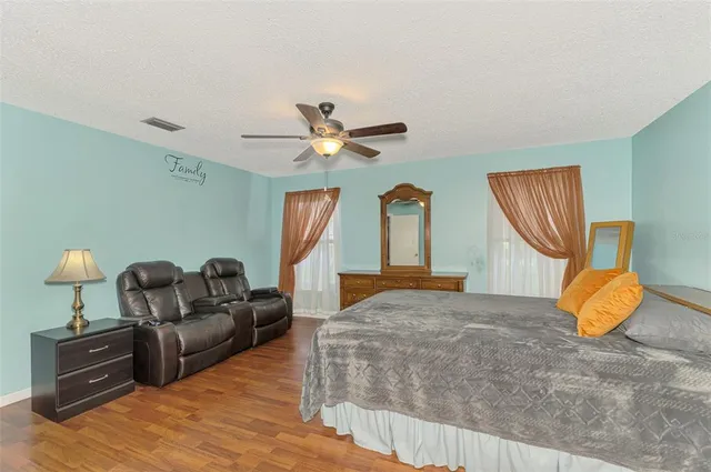 a bathroom with a sink a toilet and shower curtain