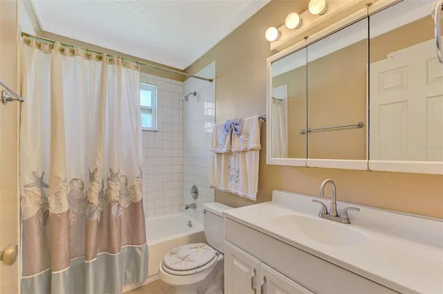 an aerial view of a house with garden space and street view