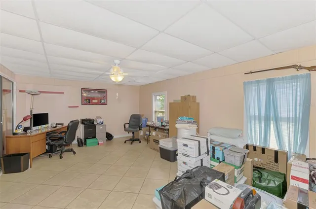 an aerial view of a house with garden space and street view
