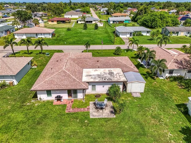 a view of a house with backyard porch and garden