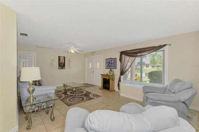 a view of a livingroom with furniture and a chandelier