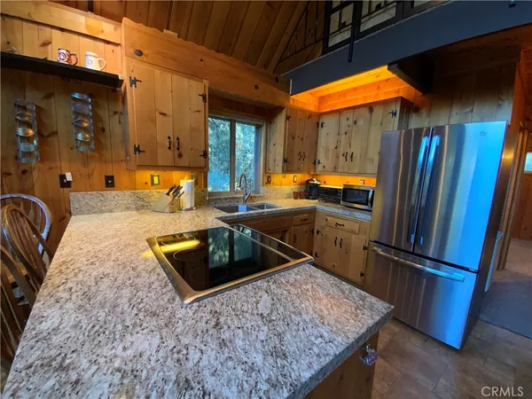 a view of living room with furniture and floor to ceiling window