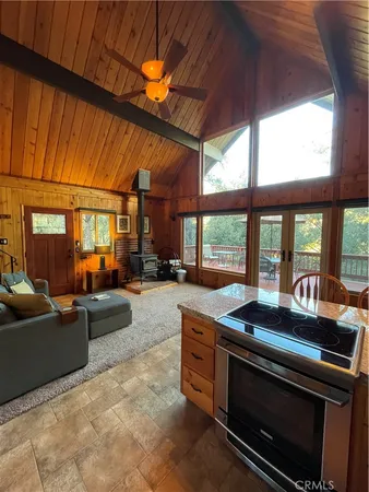a view of a kitchen with sink and cabinets