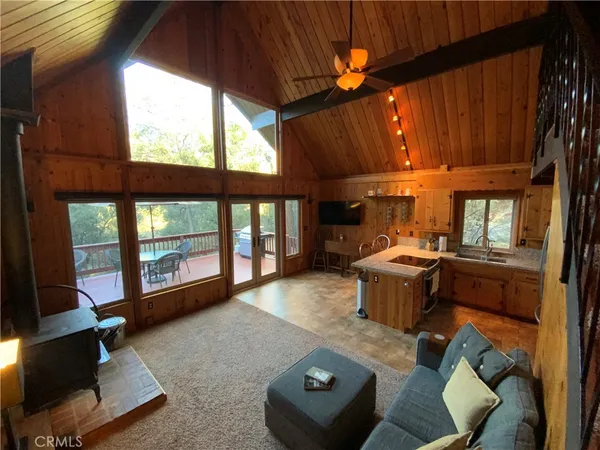a bed room with a bed and a large window