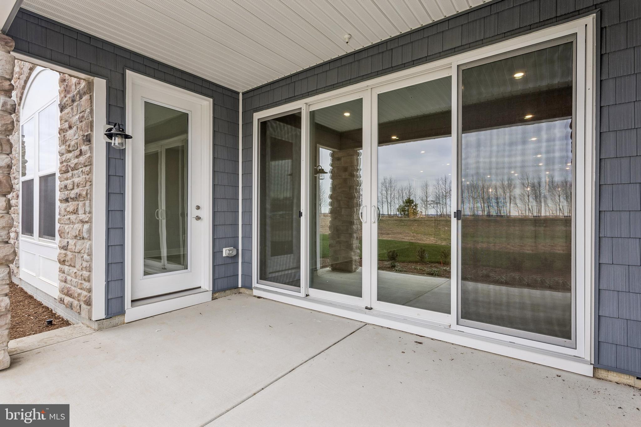 630 Warbler Way, Unit 2212 Chester, MD 21619 - Photo 23 of 73 a view of a glass door of the house