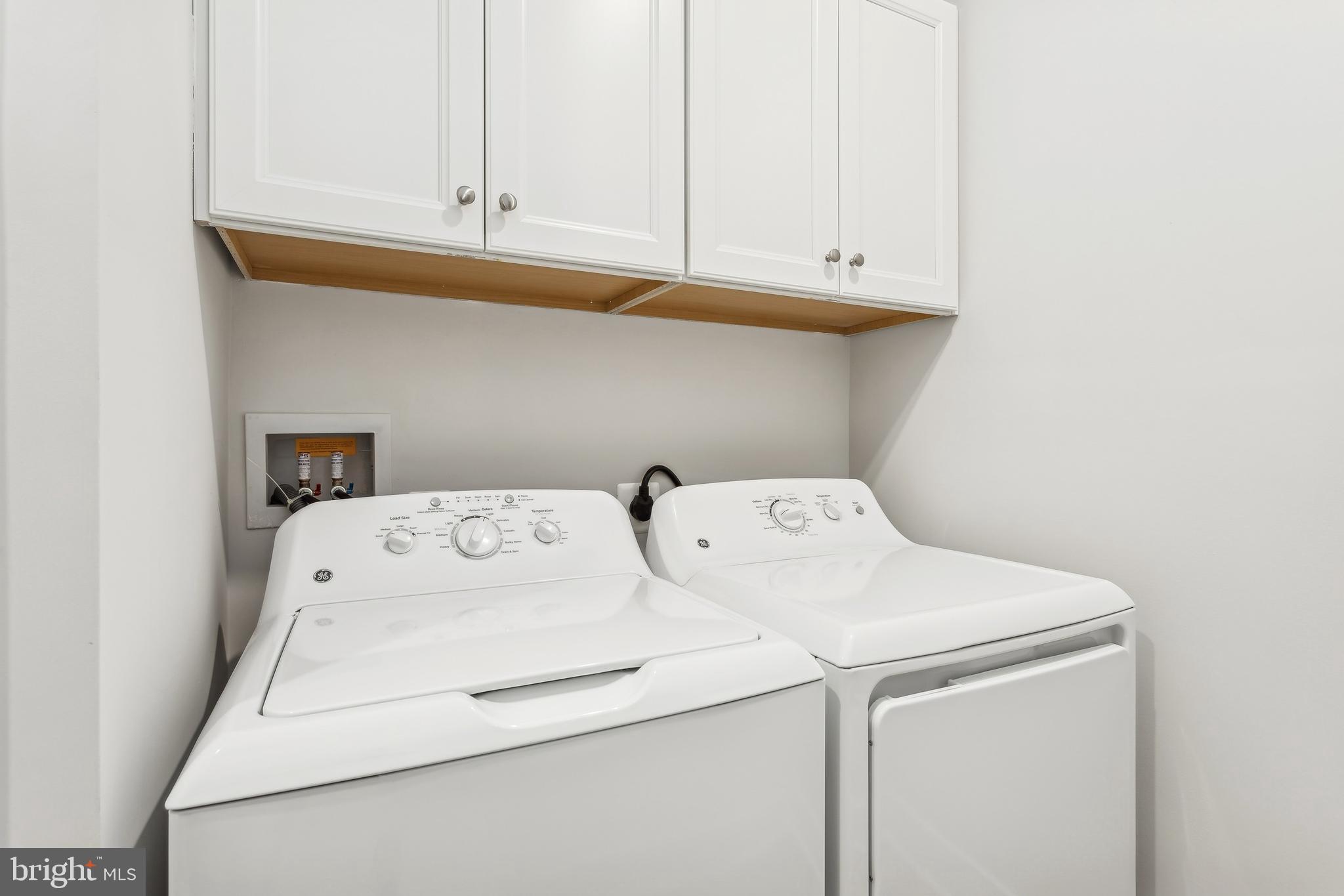 630 Warbler Way, Unit 2212 Chester, MD 21619 - Photo 28 of 73 a utility room with dryer and washer