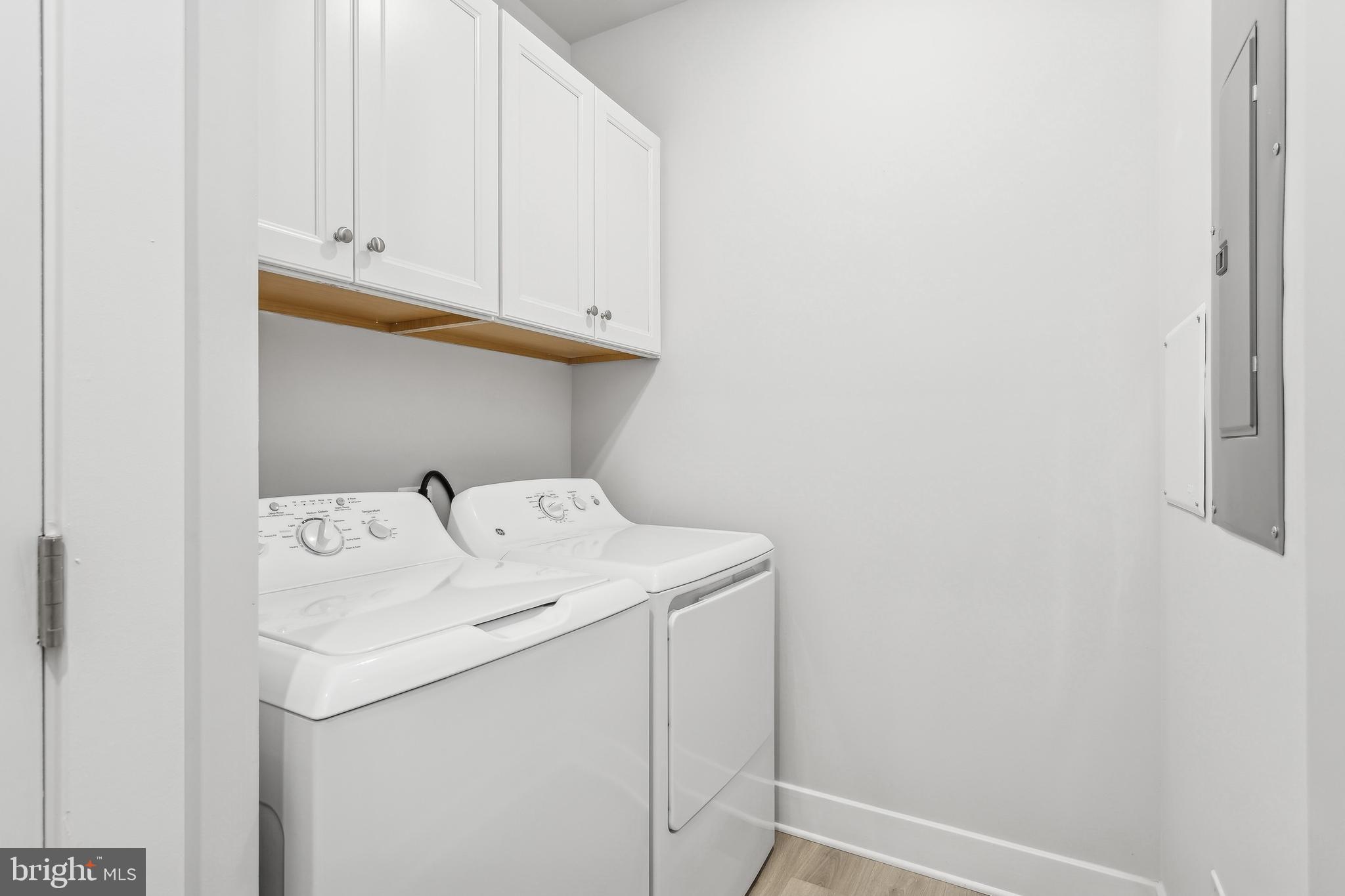 630 Warbler Way, Unit 2212 Chester, MD 21619 - Photo 30 of 73 a utility room with dryer and washer
