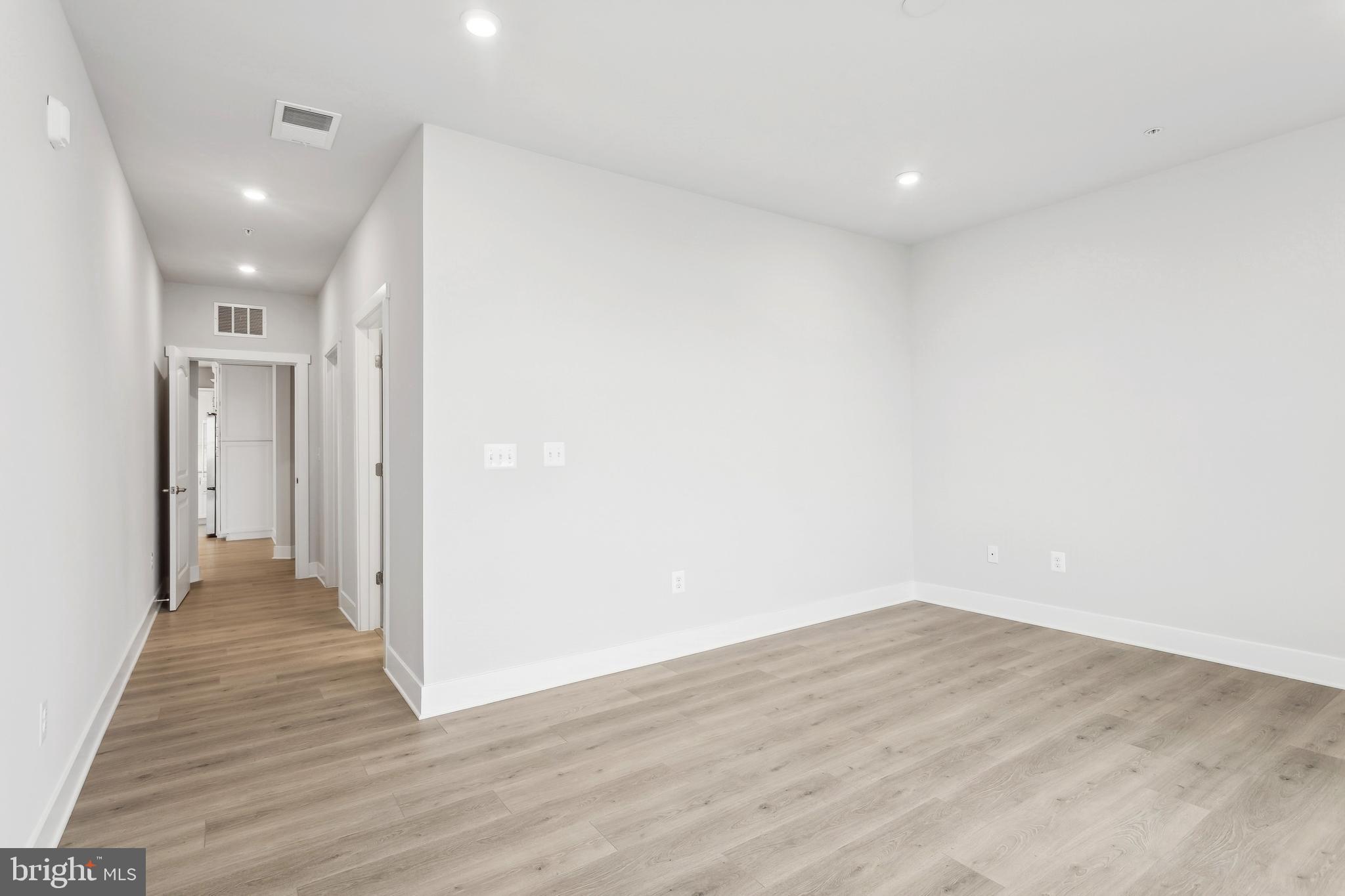 630 Warbler Way, Unit 2212 Chester, MD 21619 - Photo 3 of 73 a view of a hallway with wooden floor