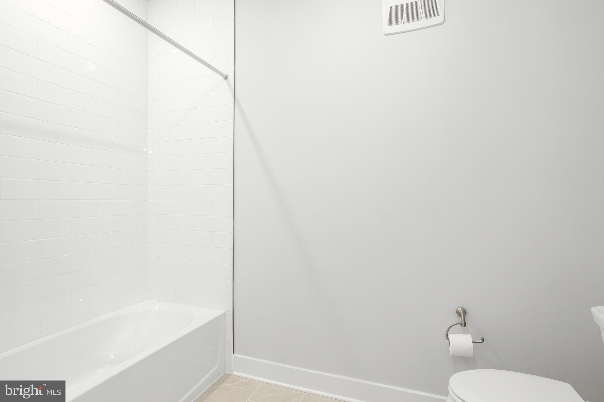 630 Warbler Way, Unit 2212 Chester, MD 21619 - Photo 32 of 73 a bathroom with a shower and a toilet