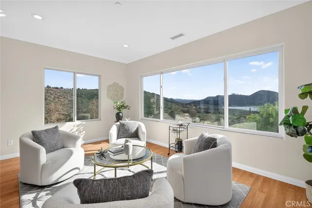 a living room with furniture and a table