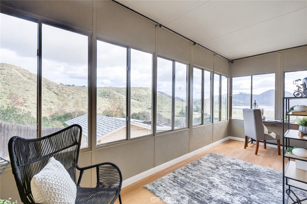 20227 Ash Lane Escondido, CA 92029 - Photo 30 of 58 a living room with furniture and a floor to ceiling window