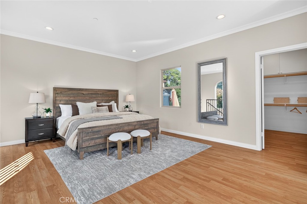 20227 Ash Lane Escondido, CA 92029 - Photo 41 of 58 a bedroom with a bed and wooden floor