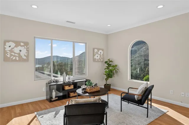 a view of a city with lush green forest