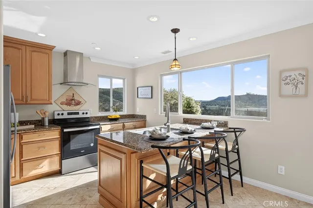 a kitchen with stainless steel appliances granite countertop a sink stove and window