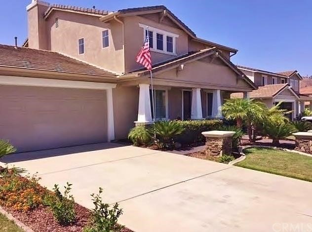 12145 Navel Tree Court Riverside, CA 92503 - Photo 1 of 1 Beautiful front yard landscaping with stone pillars and walkway.