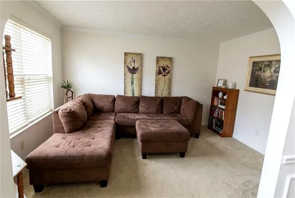 a living room with furniture and a couch