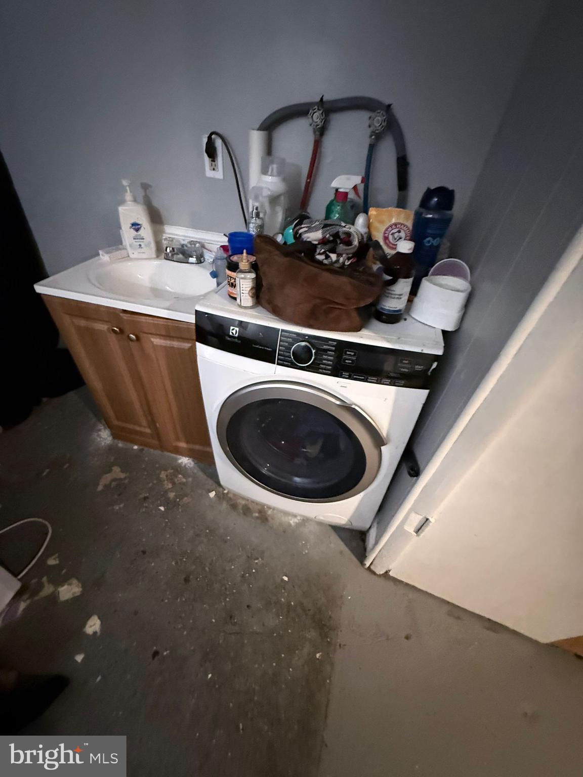 2117 Penrose Avenue Baltimore, MD 21223 - Photo 14 of 30 a view of living room with washer and dryer