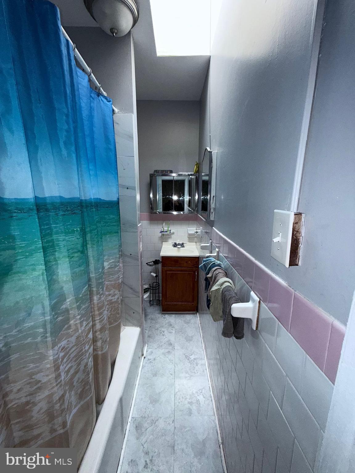 2117 Penrose Avenue Baltimore, MD 21223 - Photo 20 of 30 a bathroom with a sink and a mirror