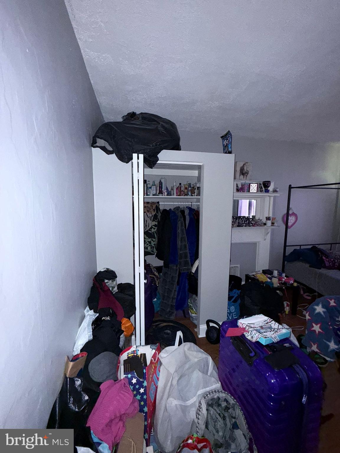 2117 Penrose Avenue Baltimore, MD 21223 - Photo 21 of 30 a bedroom with bed and a ceiling fan