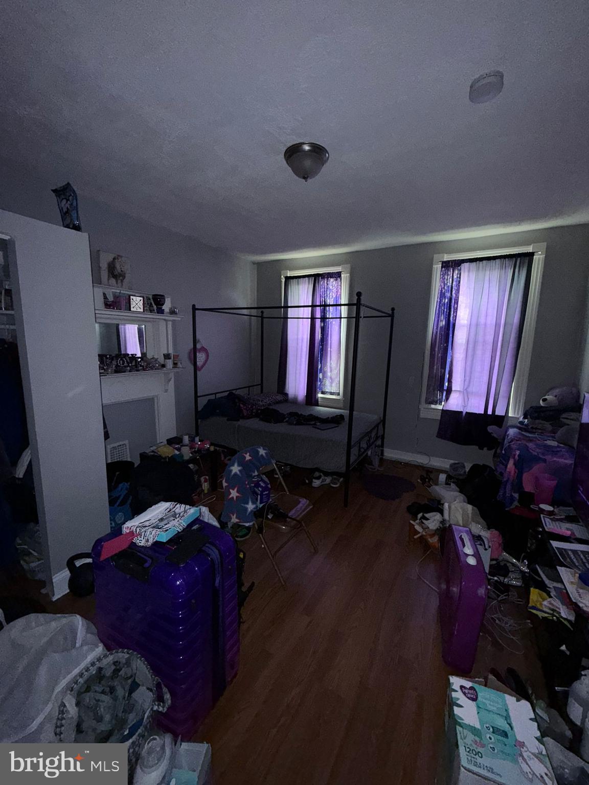 2117 Penrose Avenue Baltimore, MD 21223 - Photo 22 of 30 a room with furniture and a flat screen tv