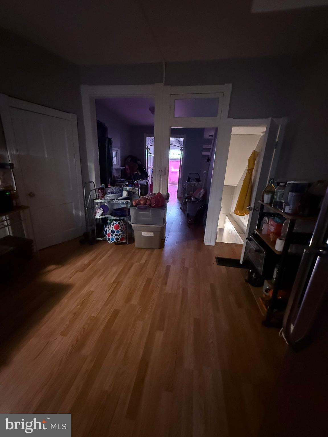 2117 Penrose Avenue Baltimore, MD 21223 - Photo 10 of 30 a living room with furniture and a wooden floor