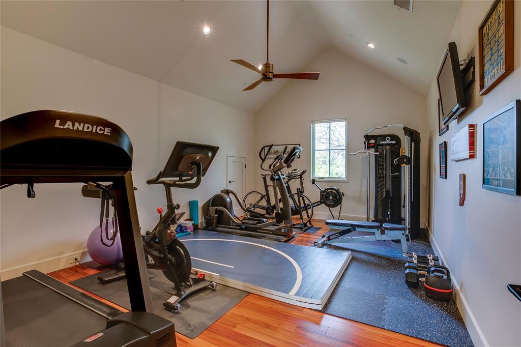 48 Ash Bluff Lane Dallas, TX 75248 - Photo 11 of 40 a view of a room with gym equipment
