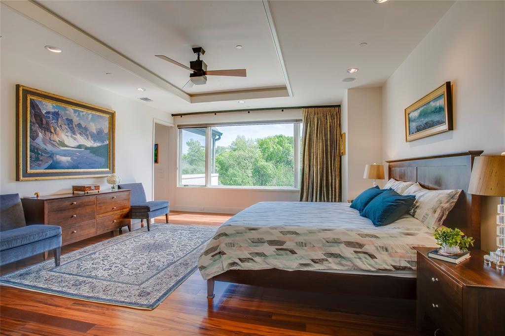 48 Ash Bluff Lane Dallas, TX 75248 - Photo 12 of 40 a bedroom with a bed couch and window