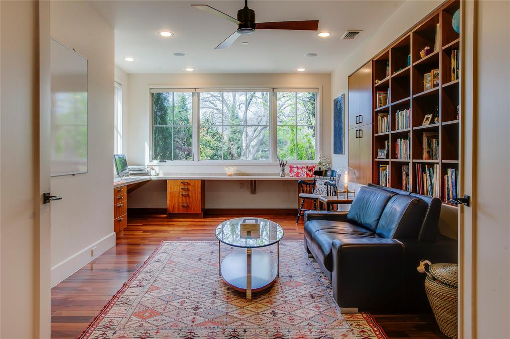 48 Ash Bluff Lane Dallas, TX 75248 - Photo 17 of 40 a living room with furniture and a book shelf